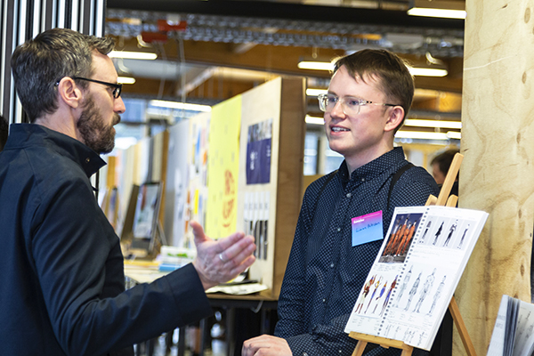 Design student talks to an industry guest at Industry Night 2019